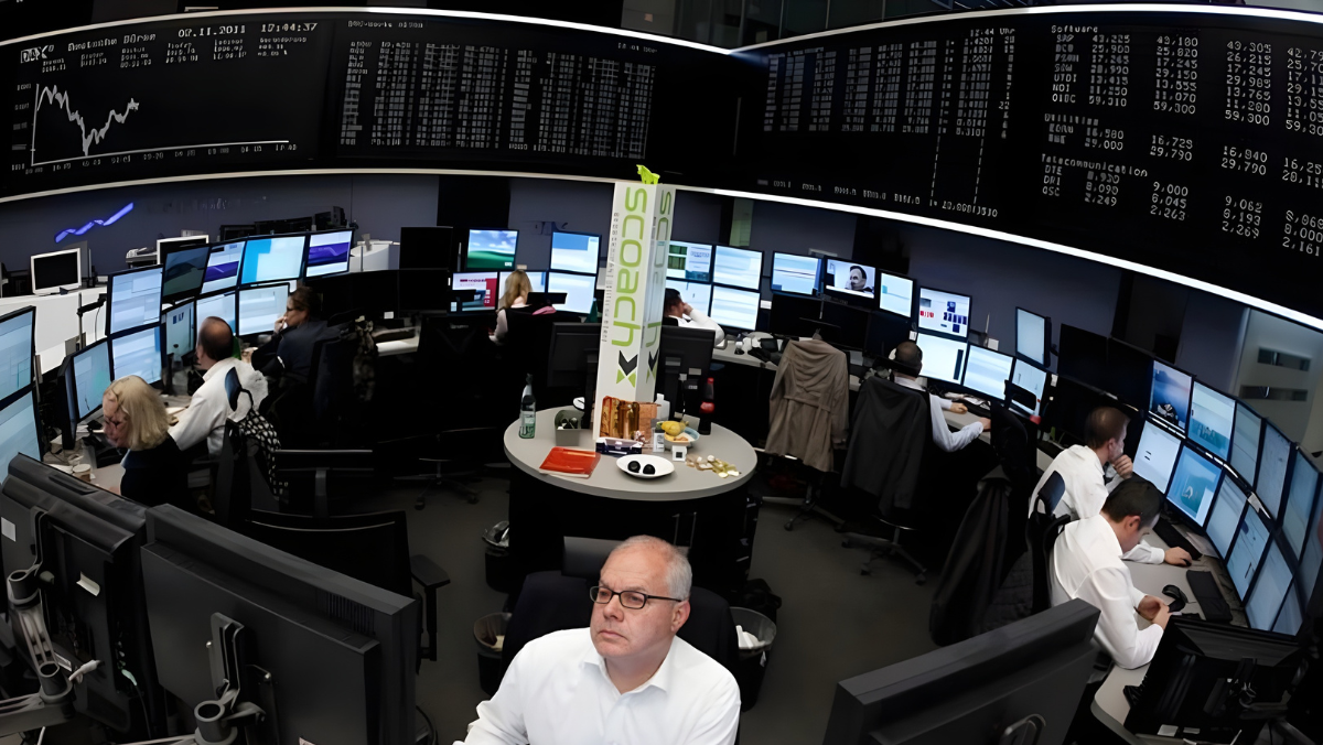 Control room staff analyzing grid data across large multi-screen displays