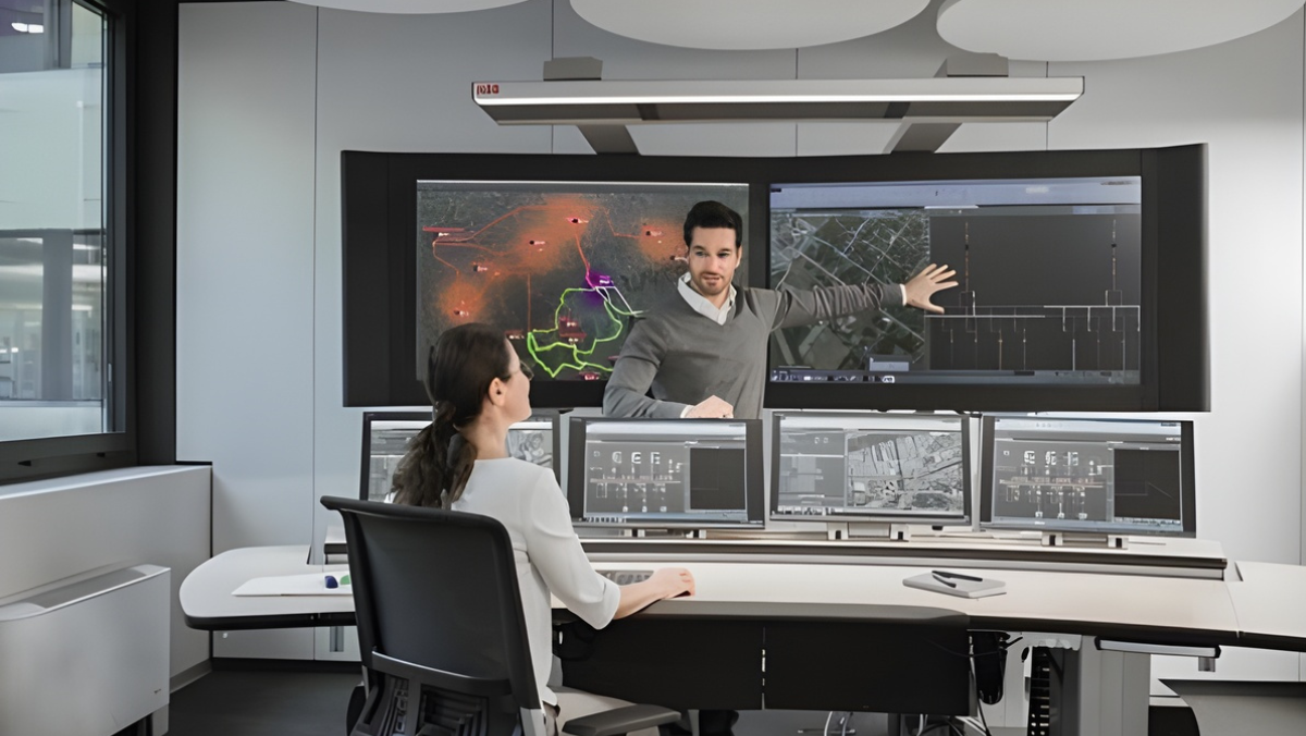 Engineers monitoring grid performance using digital control screens in a modern operations center